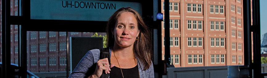 Lisa Carpenter with backpack on UH-Downtown campus