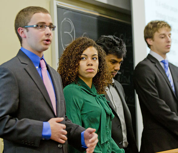 With classmates (from left) Walter Unangst, Rohit Vadakattu and Tyler Regino, Smith rehearses the final presentation for the group’s Energy Business Finance class. Smith, a Massachusetts native, was drawn to Penn State partly for its energy business finance program, her major.