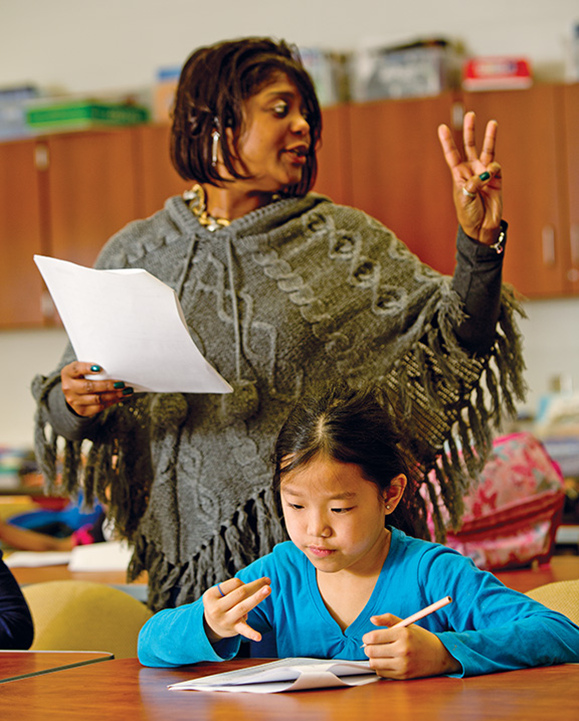 Under the supervision of Buffalo City Schools teacher Shanoda Davis, third-grader Ryana Flores participates in an academic enrichment program supported by Say Yes. The after-school program, which seeks to enhance pupils’ math and English skills, is operated through a private-public partnership with the YMCA of Buffalo Niagara.