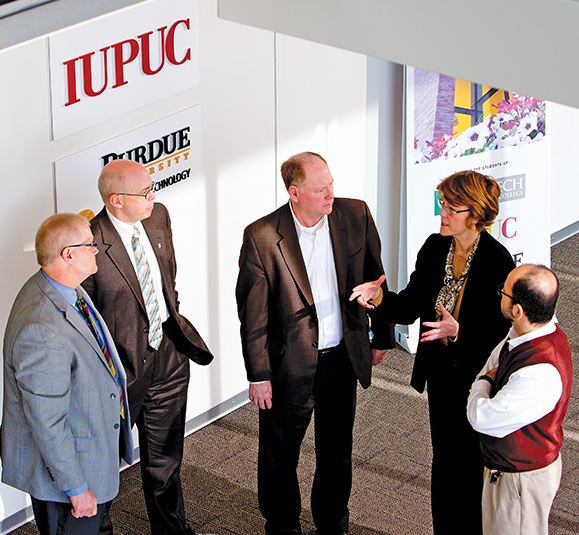 Cooperative leadership is vital to the success of the Columbus coalition. Conferring here are (from left): Joe Fuehne, director of the Purdue College of Technology at Columbus; Steven Combs, interim chancellor of Ivy Tech Community College-Columbus; John Quick, superintendent of Bartholomew Consolidated School Corp.; Kathy Griffey, superintendent of Flat Rock-Hawcreek School Corp., and Marwan Wafa, vice chancellor and dean at IUPUC.