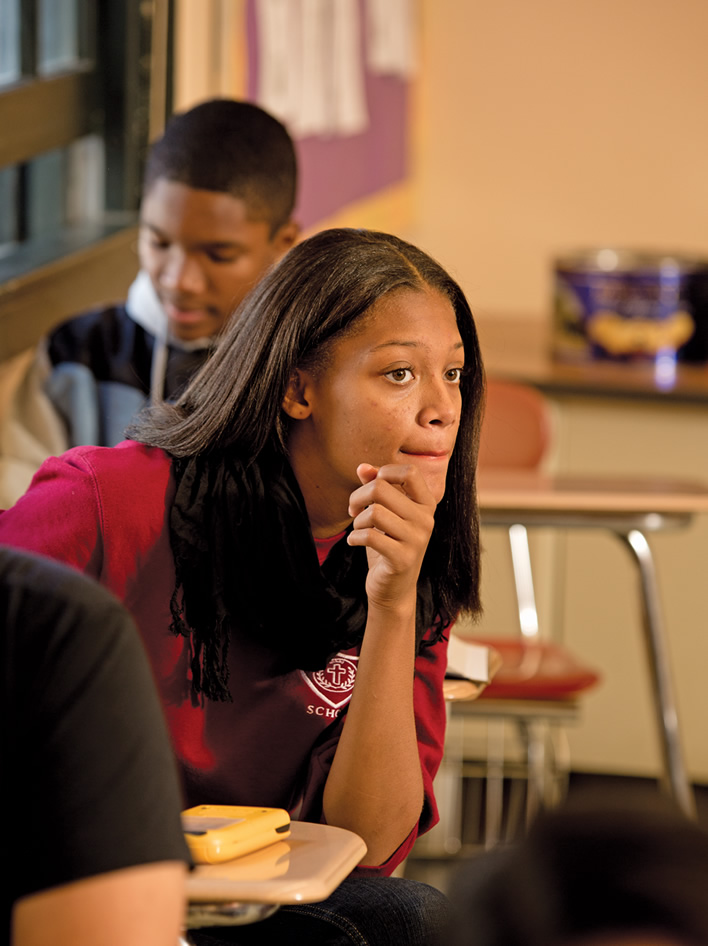 Sophomore Alyssa Sandy is the picture of concentration in her P-TECH math class. Should that focus ever waver, however, she knows she can depend on her classmates for help, particularly sophomore Kevon Cambridge, who is seated behind her. The school’s emphasis on peer learning allows them — even encourages them — to confer and cooperate.