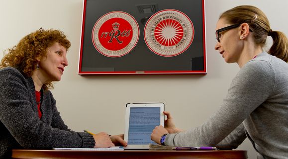 Kathryn Loder-Murphy, a disability services coordinator at Rutgers, reviews a class assignment with Carol Baillie, a junior who is a Coast Guard veteran and now serves in the Coast Guard Reserve. Loder-Murphy makes regular visits to Veterans House to talk with former service members. “I’m far more successful being on their turf,” she explains.